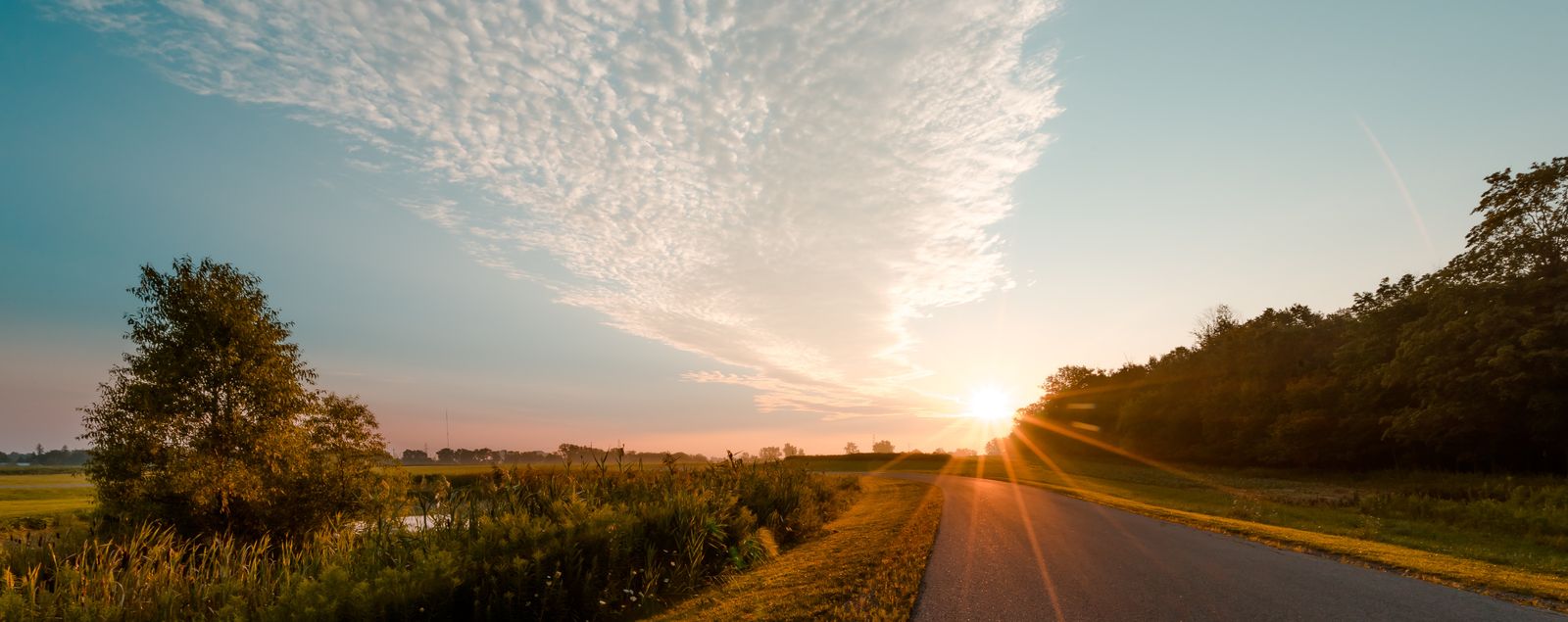 Golden sunrise over an open rural road, symbolising a clear path forward away from smoking and vaping